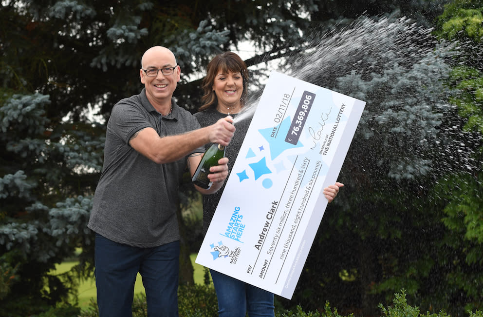 Andrew Clark, 51, from Boston, Lincolnshire, with his partner Trisha Fairhurst, celebrates his £76 million jackpot win (Picture: PA)
