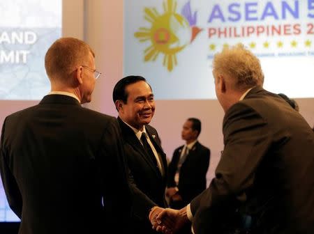 Thai Prime Minister Prayuth Chan-ocha is greeted by delegates during the 10th Indonesia - Malaysia - Thailand Growth Triangle (IMT-GT) Summit as part of the 30th Association of Southeast Asian Nations (ASEAN) summit in metropolitan Manila, Philippines April 29, 2017. REUTERS/Aaron Favila/Pool