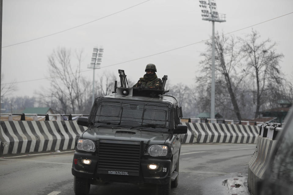 An Indian army soldier on top of his armored vehicle guards as a convoy of New Delhi-based diplomats passes through Srinagar, Indian controlled Kashmir, Thursday, Jan. 9, 2020. Envoys from 15 countries including the United States are visiting Indian-controlled Kashmir starting Thursday for two days, the first by New Delhi-based diplomats since India stripped the region of its semi-autonomous status and imposed a harsh crackdown in early August. (AP Photo/Mukhtar Khan)