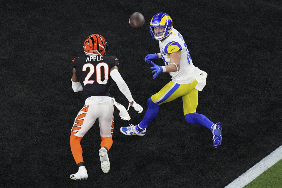 FILE - Los Angeles Rams wide receiver Cooper Kupp (10) eyes a pass in the end zone as Cincinnati Bengals cornerback Eli Apple (20) defends during the second half of the NFL Super Bowl 56 football game, Sunday, Feb. 13, 2022, in Inglewood, Calif. Bengals linebacker Logan Wilson was whistled for holding when he batted the ball away from Rams receiver Cooper Kupp on a throw from Matthew Stafford with less than 2 minutes to go. That gave Los Angeles the ball at the 4 while trailing Cincinnati 20-16; eventually Stafford hit Super Bowl MVP Kupp for a 1-yard TD. (AP Photo/Matt Rourke, File)