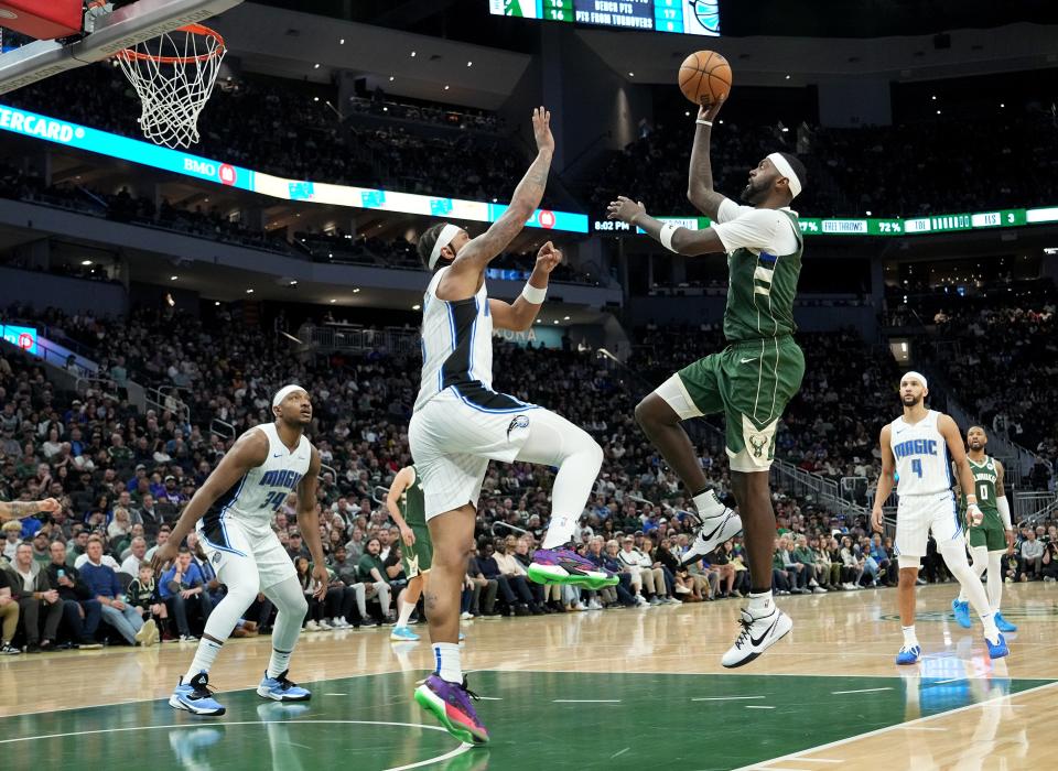 Bucks forward Bobby Portis shoots against Magic forward Paolo Banchero to score two of his 30 points Wednesday night.