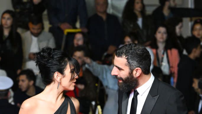 dua lipa romain gavras on the red carpet at the 76th annual cannes film festival