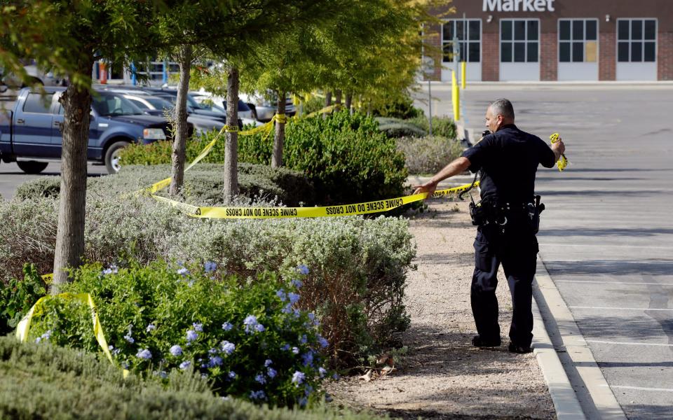 Police forensics officers work on the crime scene