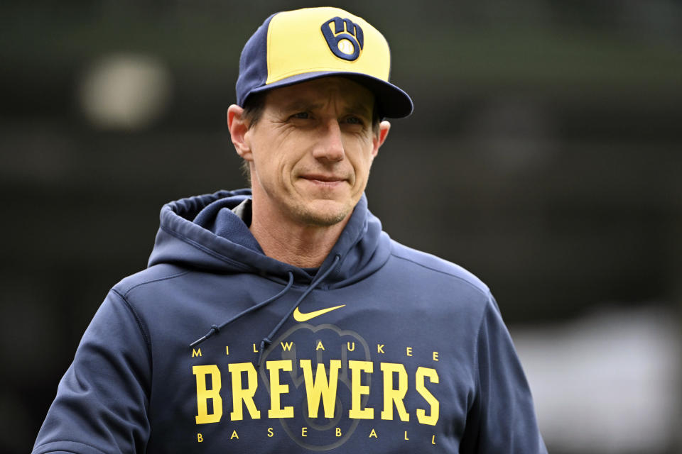 FILE - Milwaukee Brewers manager Craig Counsell looks on before a baseball game against the Chicago Cubs, Saturday, April 1, 2023, in Chicago. Major League Baseball's pitch clock has made games go faster, but players and coaches believe it also is leading to better fielding. Milwaukee manager Craig Counsell said the lengthy delays between pitches in previous seasons could make it tough for fielders to maintain their focus. (AP Photo/Quinn Harris, File)