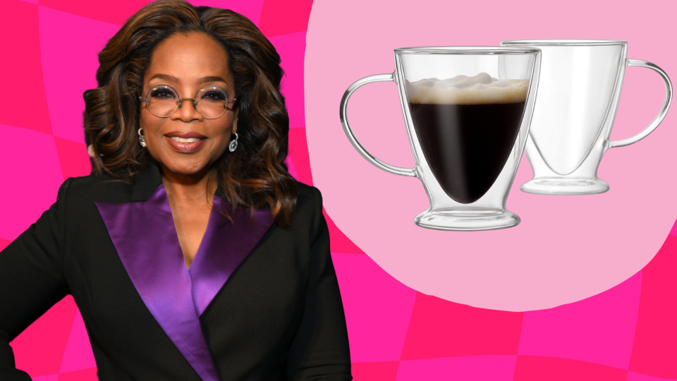 Oprah wearing a black and purple blazer next to two glass mugs, one containing coffee, on a pink background