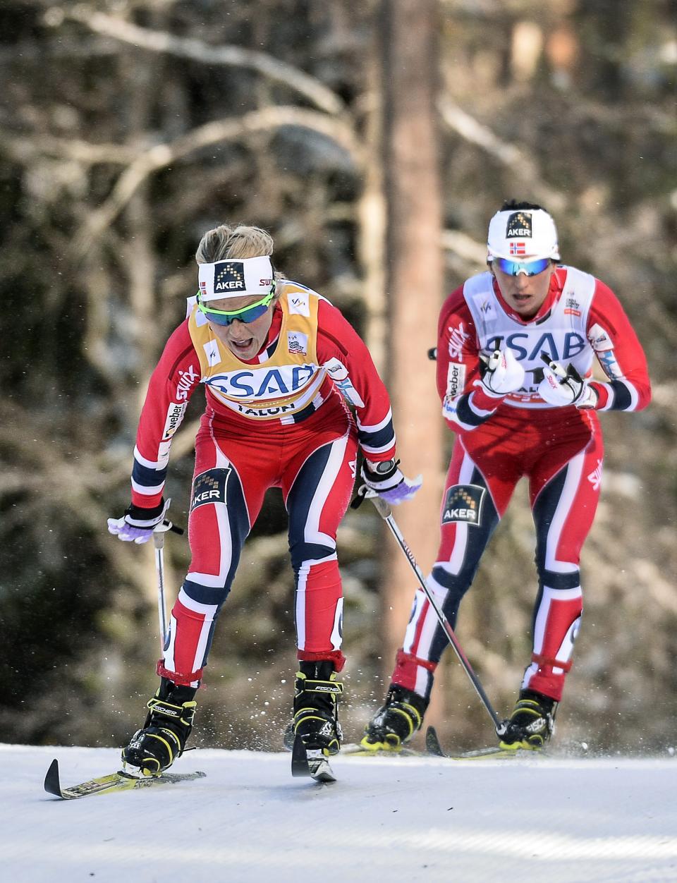 Norway's winner Therese Johaug, left, is followed by runner up Norway's Marit Bjorden during the women's FIS World Cup cross country skiathlon race in Falun, Sweden, Saturday March 15, 2014. (AP photo/TT, Anders Wiklund) SWEDEN OUT