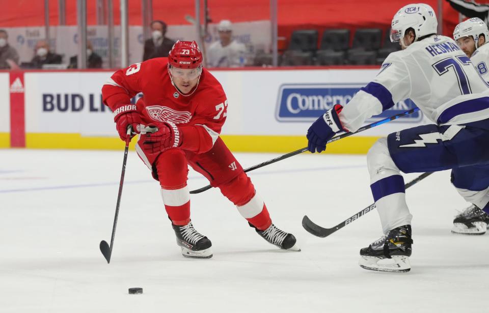 Red Wings left wing Adam Erne goes for the puck against Lightning defenseman Victor Hedman during the third period of the Wings' 1-0 shootout win on Saturday, May 1, 2021, at Little Caesars Arena.