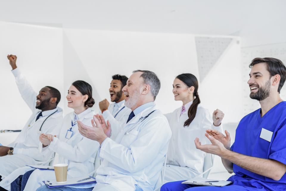 A cheering group of healthcare providers.