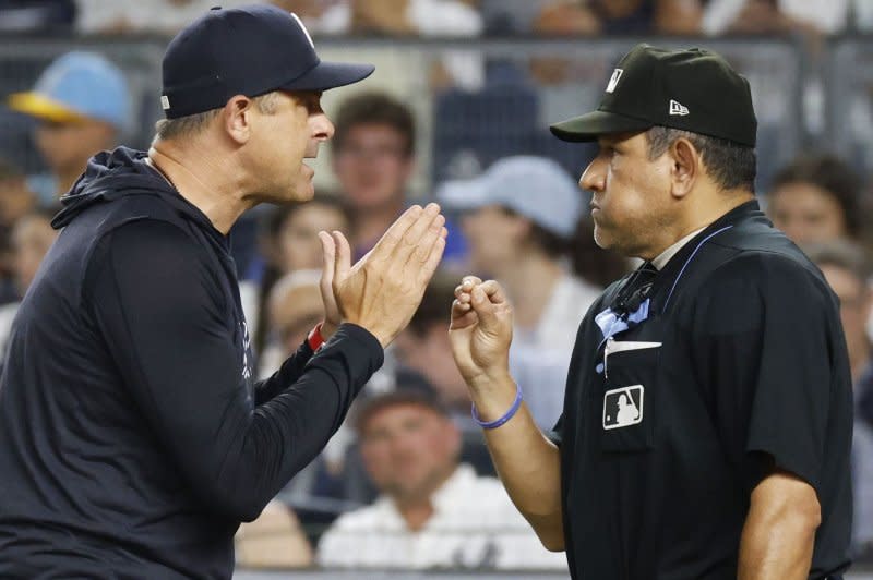 New York Yankees manager Aaron Boone (L) was ejected an MLB-high nine times in 2022. File Photo by John Angelillo/UPI