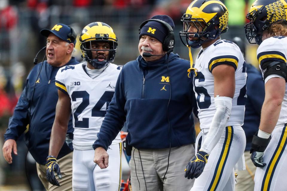 Michigan defensive coordinator Don Brown talks to players during the first half against Ohio State at Ohio Stadium in Columbus, Ohio, Saturday, Nov. 24, 2018.