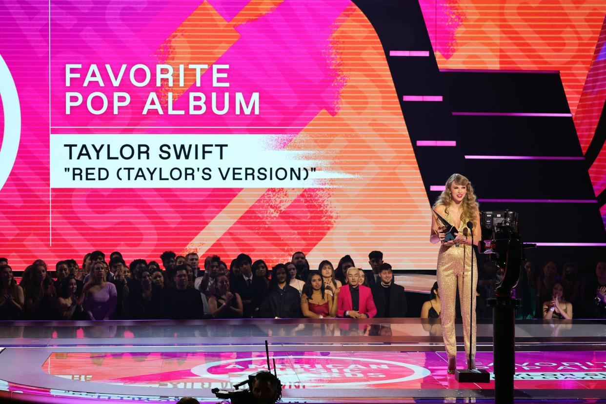 Taylor Swift accepts the Favorite Pop Album award for 'Red (Taylor's Version)' onstage during the 2022 American Music Awards at Microsoft Theater on November 20, 2022