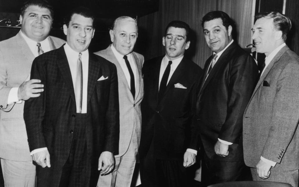 George Raft (third from left) with London gangster twins Ronnie Kray (second from left) and Reggie Kray (third from right) - Evening Standard/Hulton Archive/Getty Images