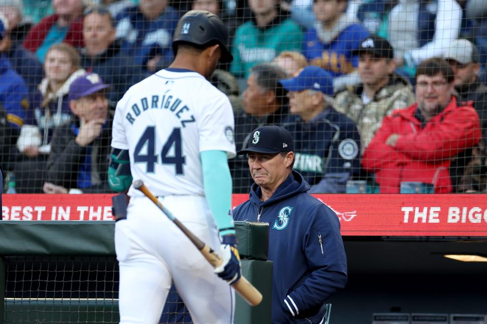 Julio Rodriguez walks back to the Mariners dugout after striking out in an April 16 game against the Reds. Through his first 22 games, Rodriguez has only three extra-base hits and no home runs, while slugging .310.