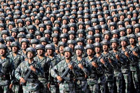 Soldiers of China's People's Liberation Army (PLA) get ready for the military parade to commemorate the 90th anniversary of the foundation of the army at Zhurihe military training base in Inner Mongolia Autonomous Region, China. China Daily via REUTERS