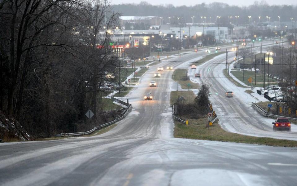 Traffic moves at a slow pace on east and west Independence Blvd. in Charlotte, NC on Sunday, January 16, 2022 as snow and sleet blanket the roadway.