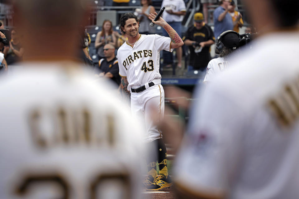 Pittsburgh Pirates relief pitcher Steven Brault (43) waves to fans after singing the National Anthem before a baseball game against the Milwaukee Brewers in Pittsburgh, Tuesday, June 19, 2018. (AP Photo/Gene J. Puskar)