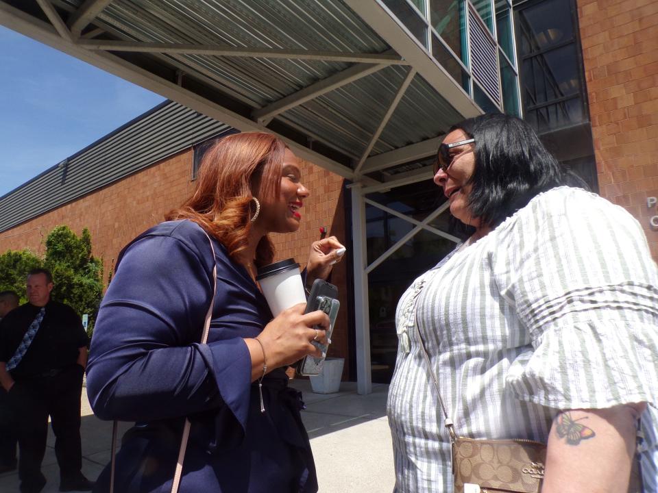 Passaic County Parole Officer Gloria Pierre-Louis congratulates Jennifer Pacifico upon her graduation from the Passaic County Recovery Court program in May 2022.