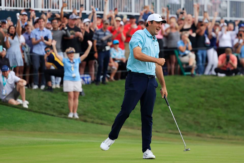 Scottie Scheffler reacts to sinking his putt on hole 18 and the tournament win during the fourth and final round of The Players golf tournament Sunday, March 12, 2023 at TPC Sawgrass in Ponte Vedra Beach, Fla. Scottie Scheffler of Dallas won the tournament at 17 under par with Tyrell Hatton at 12 under par as runner-up. 