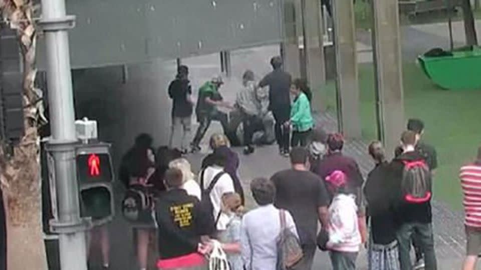 People are pushed to the pavement during the violent brawl. Source: 7 News