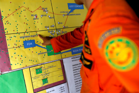 A rescue team member points to their operation map in the search and rescue command center for the crashed Lion Air flight JT610 at Tanjung Priok port in Jakarta, Indonesia, November 3, 2018. REUTERS/Willy Kurniawan/Files