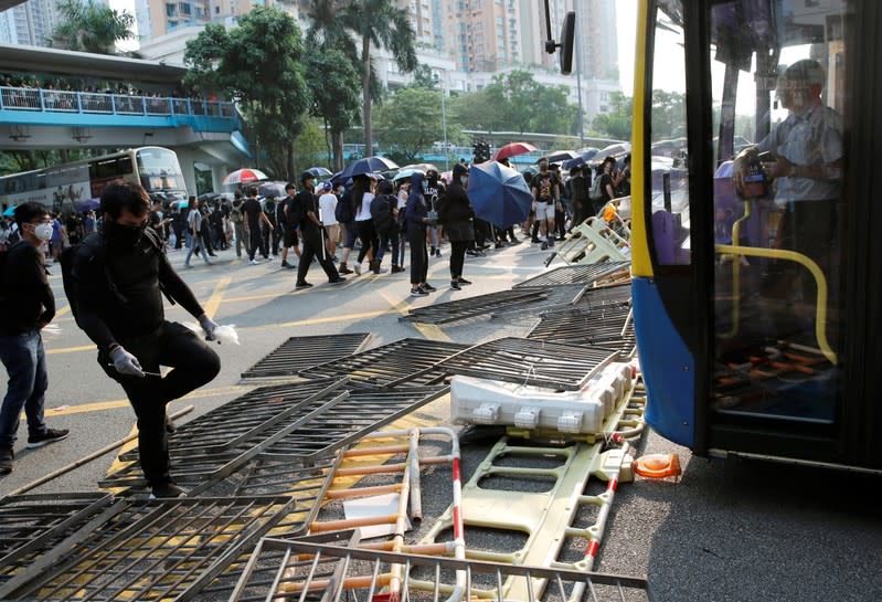 Anti-government demonstrators build a barricade during a protest march in Hong Kong