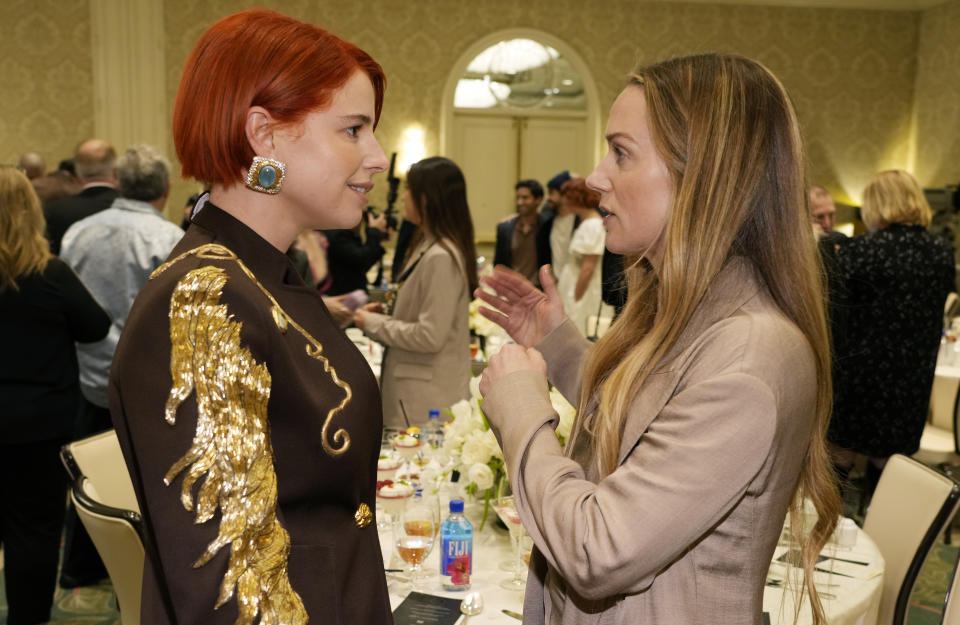 Actors Jessie Buckley, left, and Kerry Condon mingle at the 2023 AFI Awards, Friday, Jan. 13, 2023, at the Four Seasons Beverly Hills in Los Angeles. (AP Photo/Chris Pizzello)
