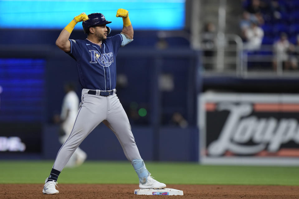 Tampa Bay Rays' Jose Siri celebrates after hitting a double scoring Vidal Brujan and Isaac Paredes during the sixth inning of a baseball game against the Miami Marlins, Tuesday, Aug. 29, 2023, in Miami. (AP Photo/Wilfredo Lee)