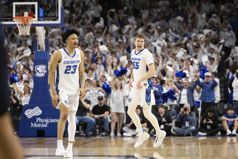 Creighton's Baylor Scheierman (55) celebrates alongside Trey Alexander (23) after making a three point shot against Marquette during the second half of an NCAA college basketball game Saturday, March 2, 2024, in Omaha, Neb. Creighton defeated Marquette 89-75. (AP Photo/Rebecca S. Gratz)