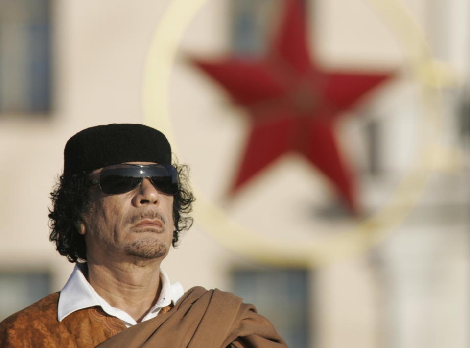 FILE - Then Libyan leader Moammar Gadhafi attends a wreath laying ceremony in the Belarus capital Minsk Nov. 3, 2008. Longtime Libyan dictator Gadhafi is hunted and summarily killed by insurgents after being toppled in a NATO-backed uprising on Oct. 20, 2011.(AP Photo/Sergei Grits, File)