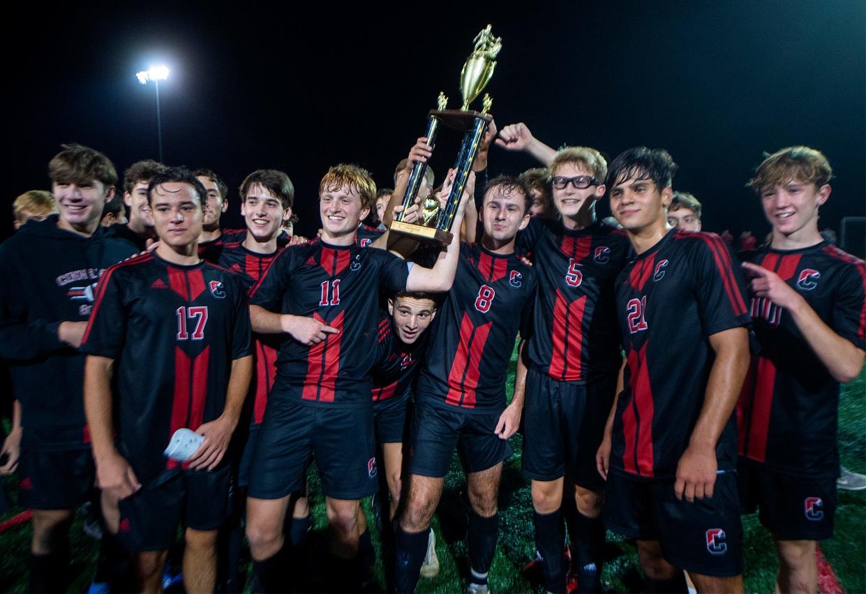 Cinnaminson High Schooll boys soccer team celebrates winning the SJ Coaches Tournament, held at DeCou Soccer Complex in Cherry Hill, on Saturday, Oct. 30, 2021.