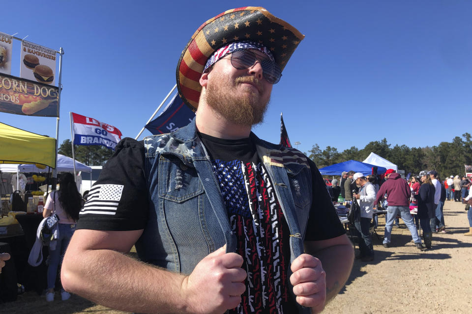 Thor Pearson of El Paso, Texa,s attends former President Donald Trump's rally in Conroe, Texas, Saturday, Jan. 29, 2022. At Trump’s rally, there were signs of change. Next to the Trump hats, shirts and flags sat a collection of Ron “DeSantis 2024” bumper stickers. The vast majority of those interviewed at Trump’s rally enthusiastically cheered the prospect of another Trump run. But there were some who conceded that, perhaps, there might be a better option. (AP Photo/Jill Colvin)