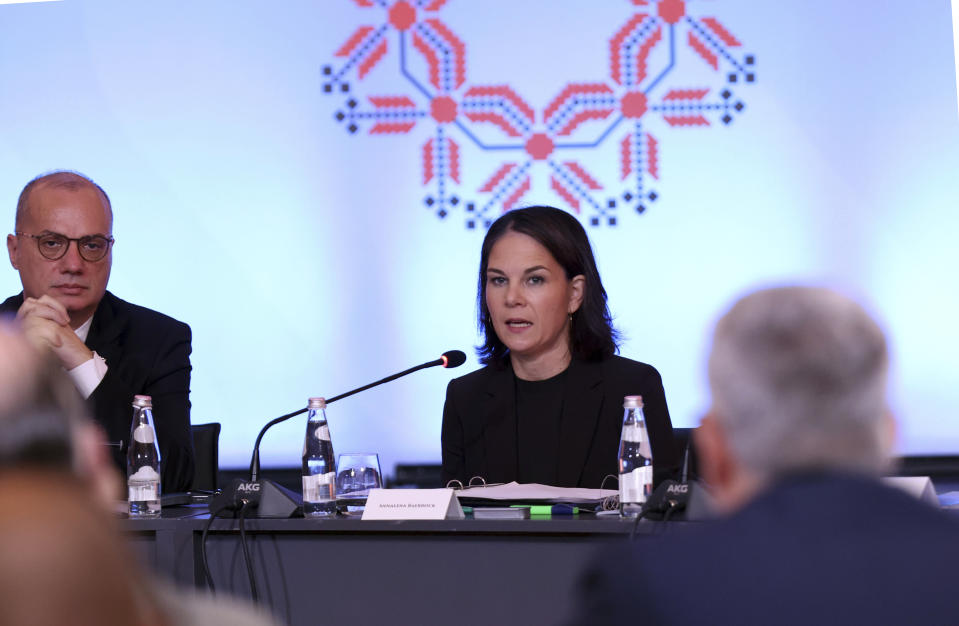 German Foreign Minister Annalena Baerbock speaks as his Albanian counterpart Igli Hasani looks on during a summit in Tirana, Albania, Friday, Oct. 6, 2023. Germany's foreign minister on Friday expressed the European Union's deep concerns following the recent shootout between masked Serb gunmen and Kosovo police that left four people dead and sent tensions soaring in the region. (AP Photo/Franc Zhurda)