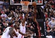 Nov 25, 2018; Toronto, Ontario, CAN; Miami Heat guard Dwyane Wade (3) shoots for a basket over the reach of Toronto Raptors forward Kawhi Leonard (2) in the second half at Scotiabank Arena. Mandatory Credit: Dan Hamilton-USA TODAY Sports