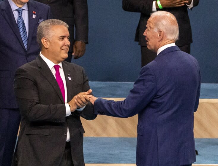 Los Angeles, CA - June 10: President of Colombia Ivan Duque Marquez, left, US President Joe Biden, speaking following the group photo of leaders at the IX Summit of the Americas at the LA Convention Center in Los Angeles on Friday, June 10, 2022. (Francine Orr/ Los Angeles Times)