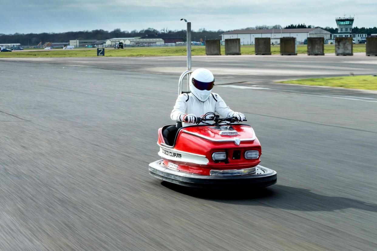 Record breaker: The Stig breaks 100mph in a dodgem: PA