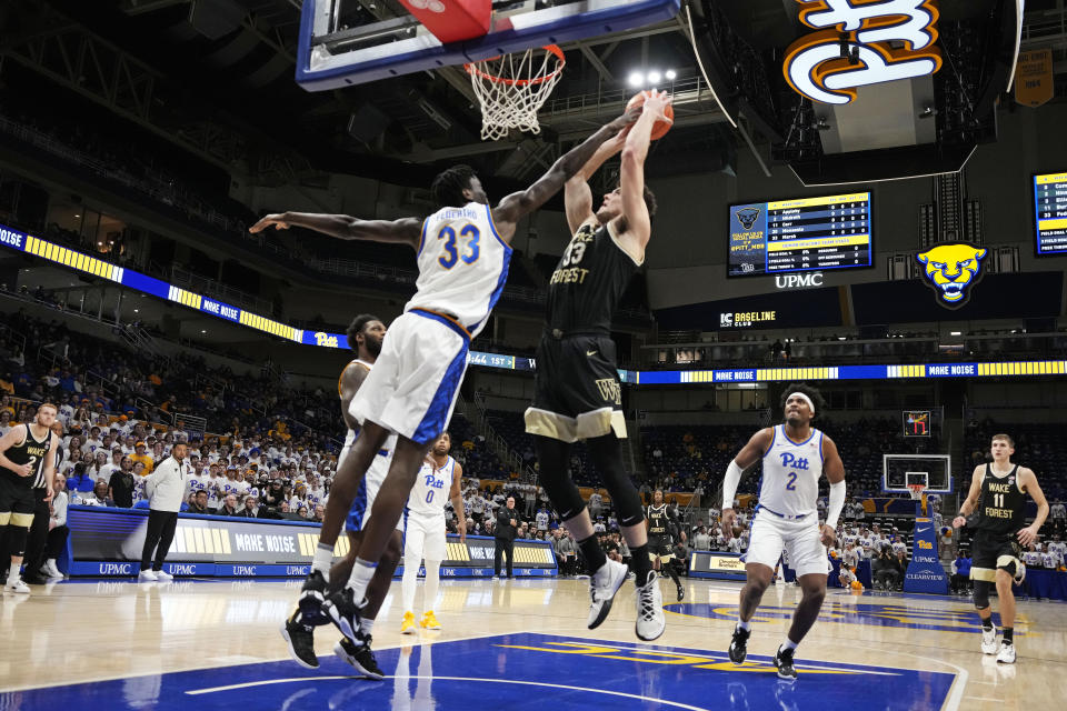 Pittsburgh center Federiko Federiko (33) blocks a shot attempt by Wake Forest forward Matthew Marsh (33) during the first half of an NCAA college basketball game in Pittsburgh, Wednesday, Jan. 25, 2023. (AP Photo/Gene J. Puskar)