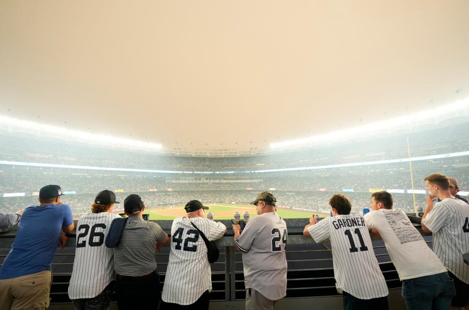 Yankee fans watch the game against the White Sox as a thick haze from the Canadian wildfires hover over The Bronx. Tuesday, June 6, 2023.