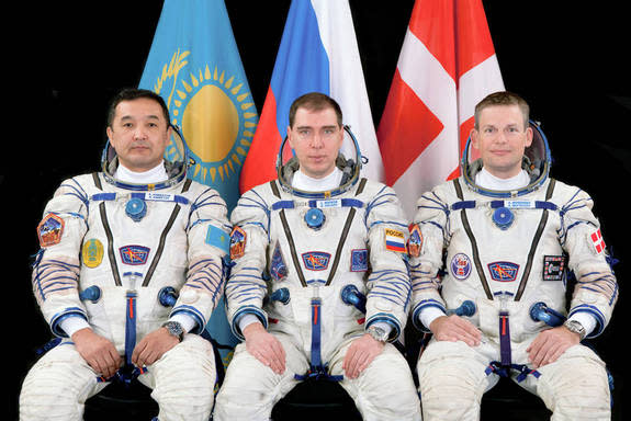 (L to R) Aidyn Aimbetov of the Kazakh Space Agency, Sergei Volkov of the Russian Federal Space Agency and Andreas Mogensen of the European Space Agency (ESA) will launch from the Baikonur Cosmodrome in Kazakhstan Wednesday, Sept. 2, 2015, and h