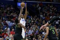 Los Angeles Clippers forward Kawhi Leonard (2) shoots against New Orleans Pelicans forward Zion Williamson (1) during the first half of an NBA basketball game in New Orleans, Friday, March 15, 2024. (AP Photo/Matthew Hinton)