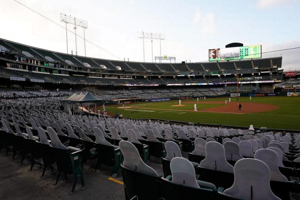 A general view of the lower bowl seating at Oakland Coliseum with cardboard cutout fans during a 2020 Oakland Athletics game. The A’s will play at Sutter Health Park in West Sacramento for three seasons, with an option to add another year, starting in 2025.