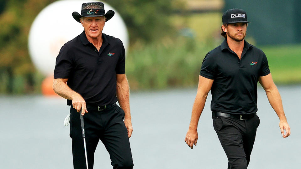 Greg Norman, pictured here with his son at the PNC Championship in December. 