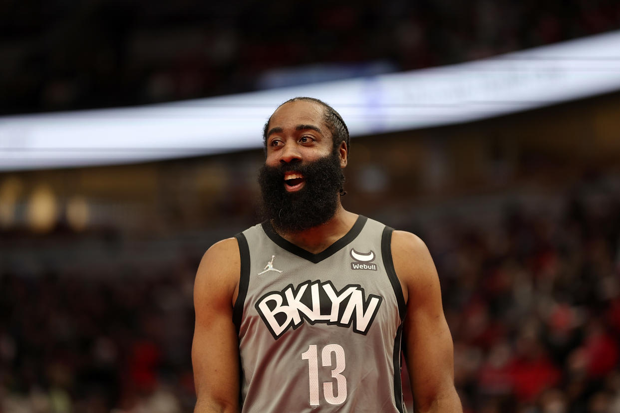 James Harden of the Brooklyn Nets smiles during a game. 