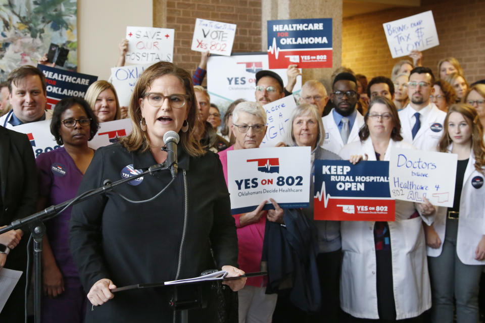 Amber England, who headed the campaign to put Medicaid expansion on the ballot in Oklahoma, speaks before supporters of Yes on 802 Oklahomans Decide Healthcare deliver petitions to the Oklahoma Secretary of State's office, Thursday, Oct. 24, 2019, in Oklahoma City. (AP Photo/Sue Ogrocki)