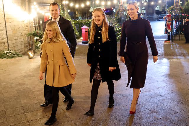 <p>Chris Jackson/Getty Images</p> Peter Phillips, Isla Phillips, Savannah Phillips and Zara Tindall attend The "Together At Christmas" Carol Service at Westminster Abbey on December 8, 2023.
