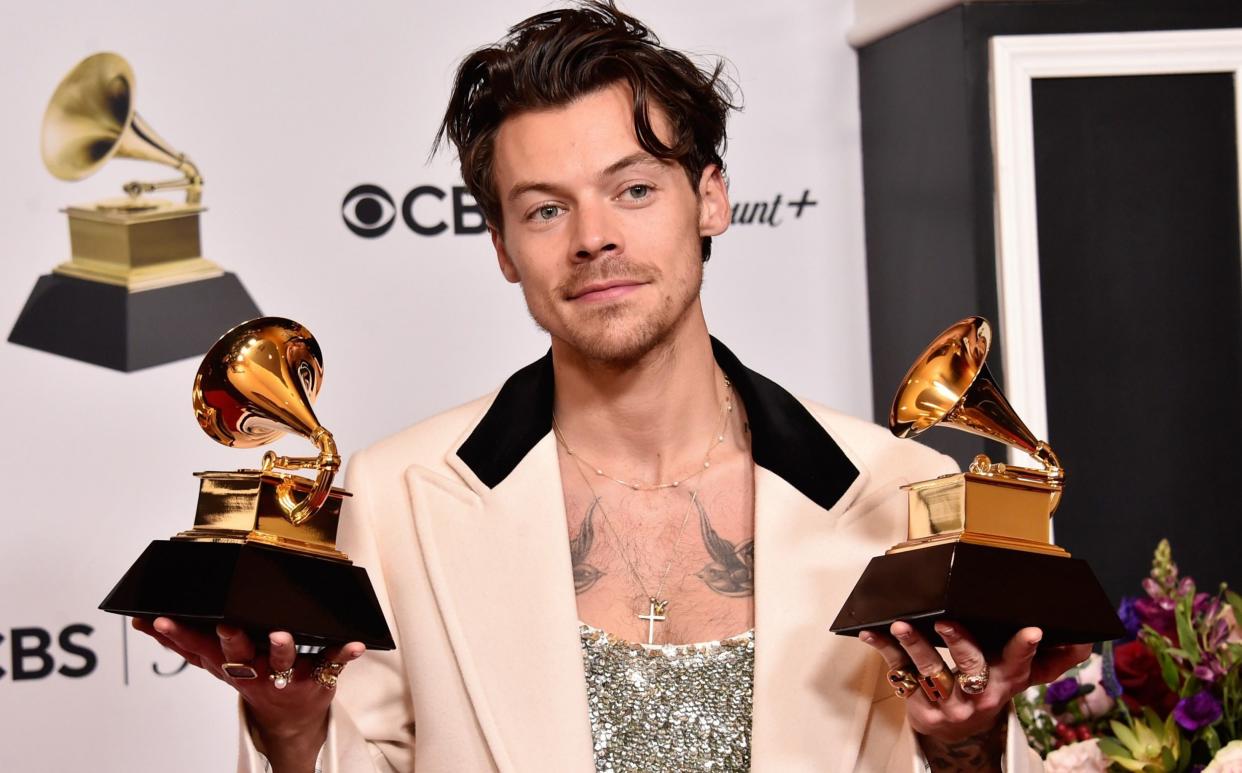 Harry Styles with his Grammy awards for Best Pop Vocal Album and Album of the Year - Alberto E. Rodriguez/Getty Images for The Recording Academy