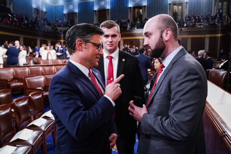 Speaker of the House Mike Johnson (L) talks to a colleague as he arrives before President Joe Biden delivers the annual State of the Union speech to a joint session of Congress at the U.S. Capitol in Washington, D.C., on Thursday. Pool Photo by Shawn Thew/UPI