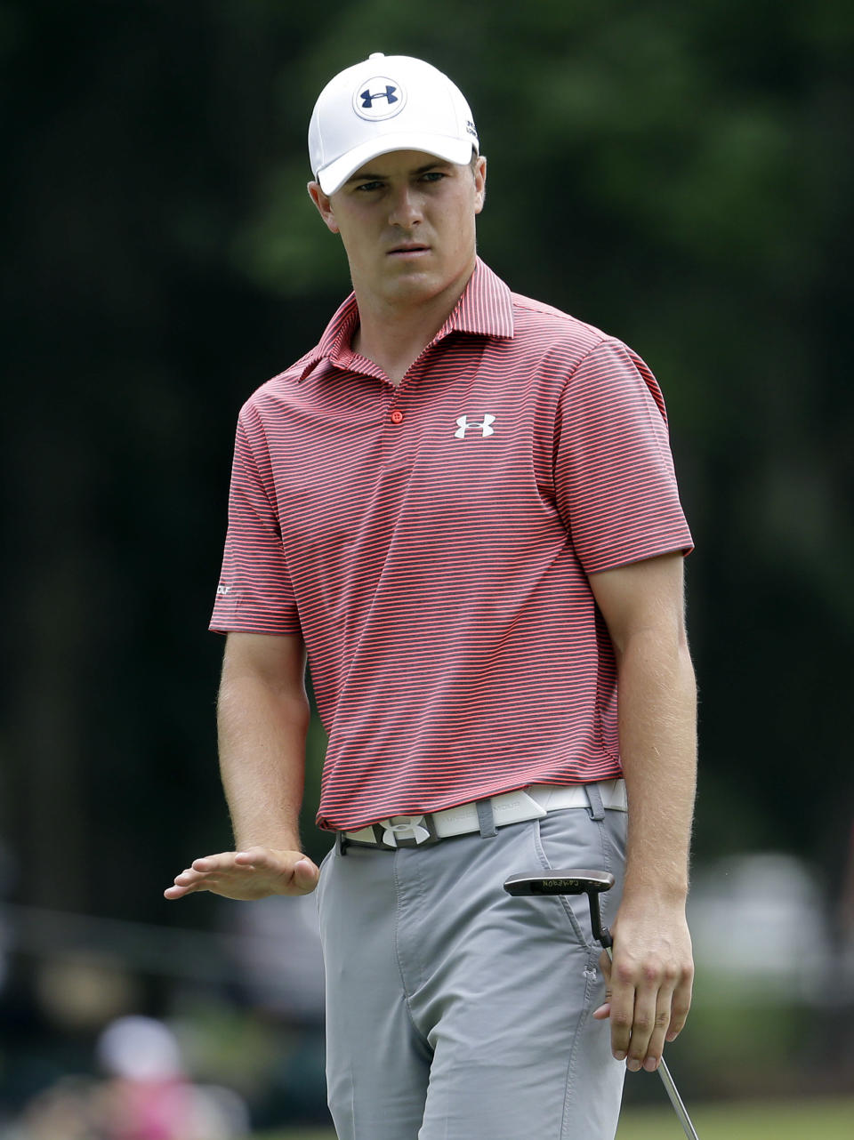 Jordan Spieth gestures at his ball on the first green during the final round of The Players championship golf tournament at TPC Sawgrass, Sunday, May 11, 2014, in Ponte Vedra Beach, Fla. (AP Photo/Lynne Sladky)