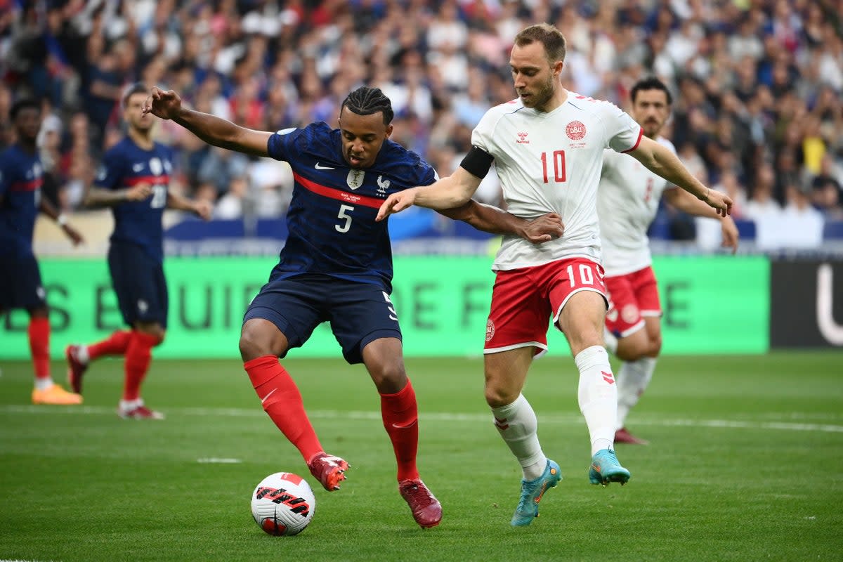 France’s Jules Kounde fights for the ball with Denmark’s Christian Eriksen (AFP via Getty Images)