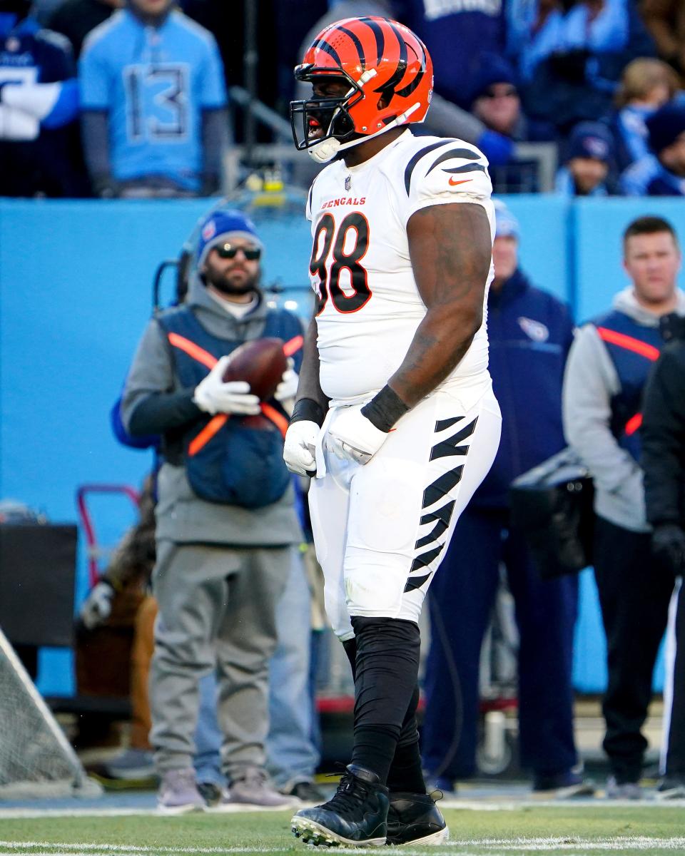 Cincinnati Bengals nose tackle D.J. Reader (98) reacts after a tackle for loss in the first quarter during an NFL divisional playoff football game against the Tennessee Titans, Saturday, Jan. 22, 2022, at Nissan Stadium in Nashville.