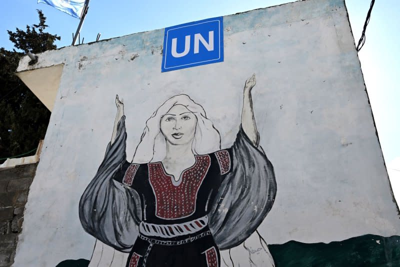 A mural of a Palestinian woman adorns the United Nations Relief and Works Agency for Palestinian Refugees school in the Dheisheh refugee camp near Bethlehem, West Bank. Photo by Debbie Hill/UPI